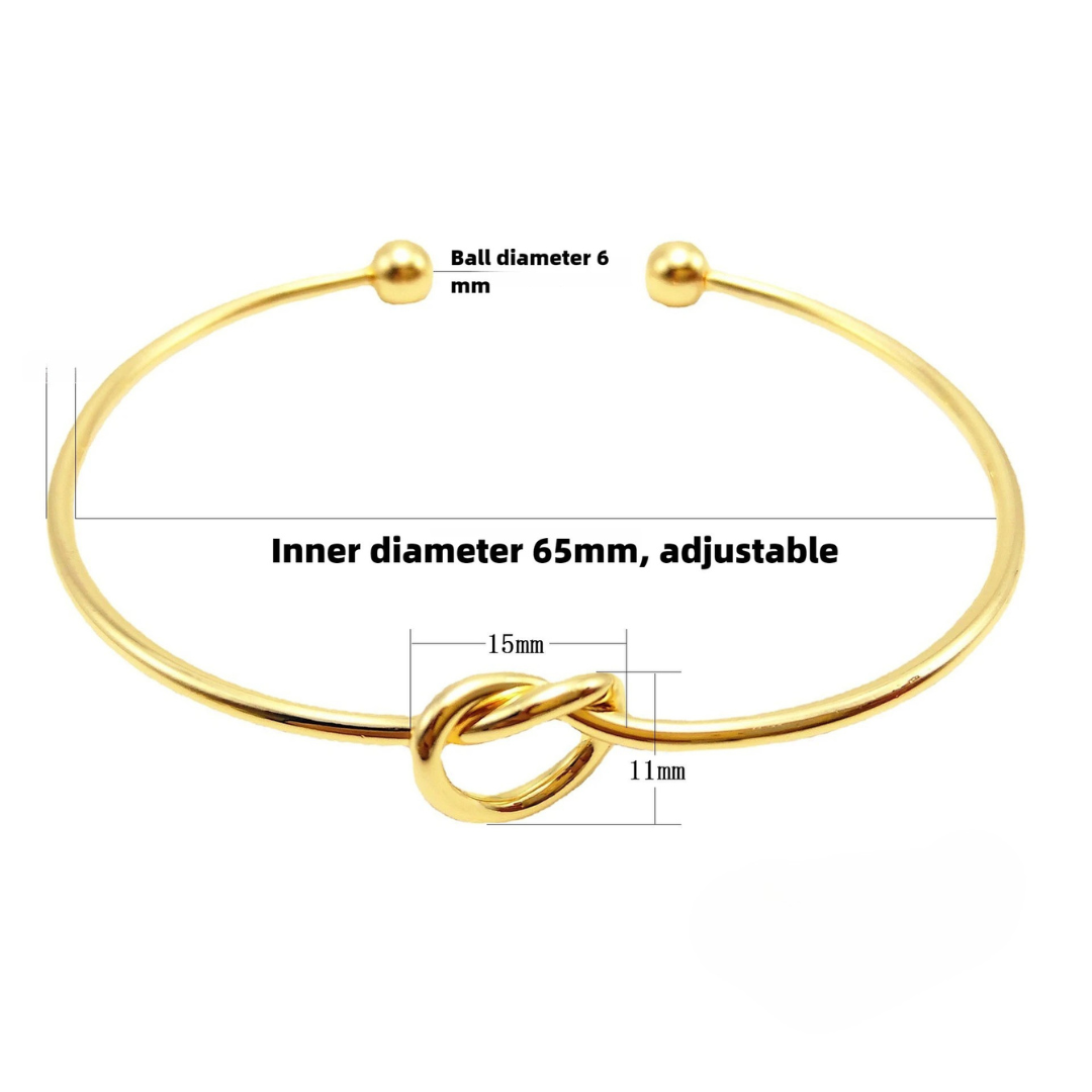 Goldene Armband mit Knotendetail